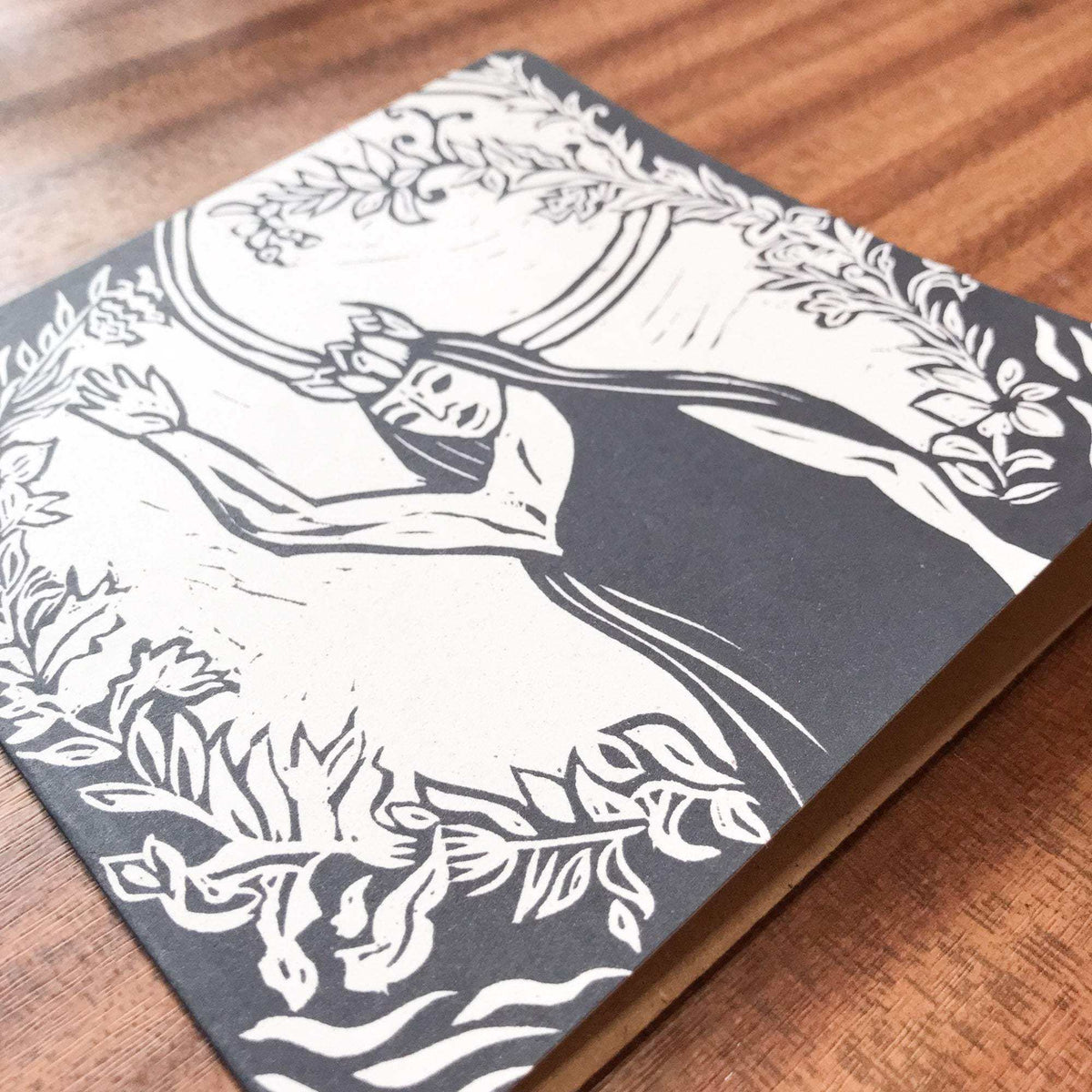 QUEEN ELPHAME greeting card with a black and white linocut figure framed by flowing floral and leafy details