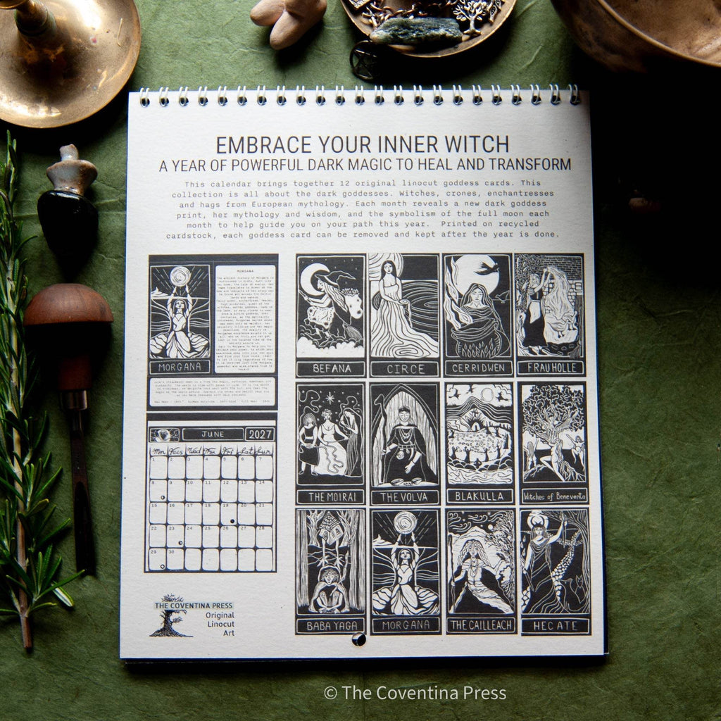 SACRED WITCH 2027 wall calendar with black-and-white goddess linocut artwork, monthly grids and metal spiral binding
