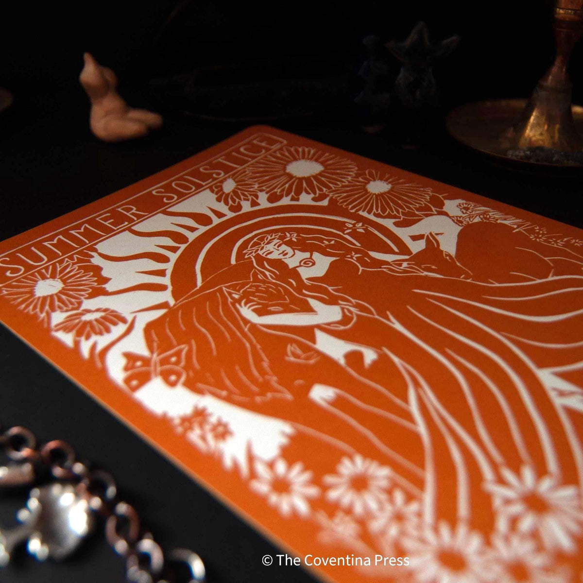 SUMMER SOLSTICE altar card in burnt orange and cream, featuring a linocut-style goddess with flowing hair and flowers