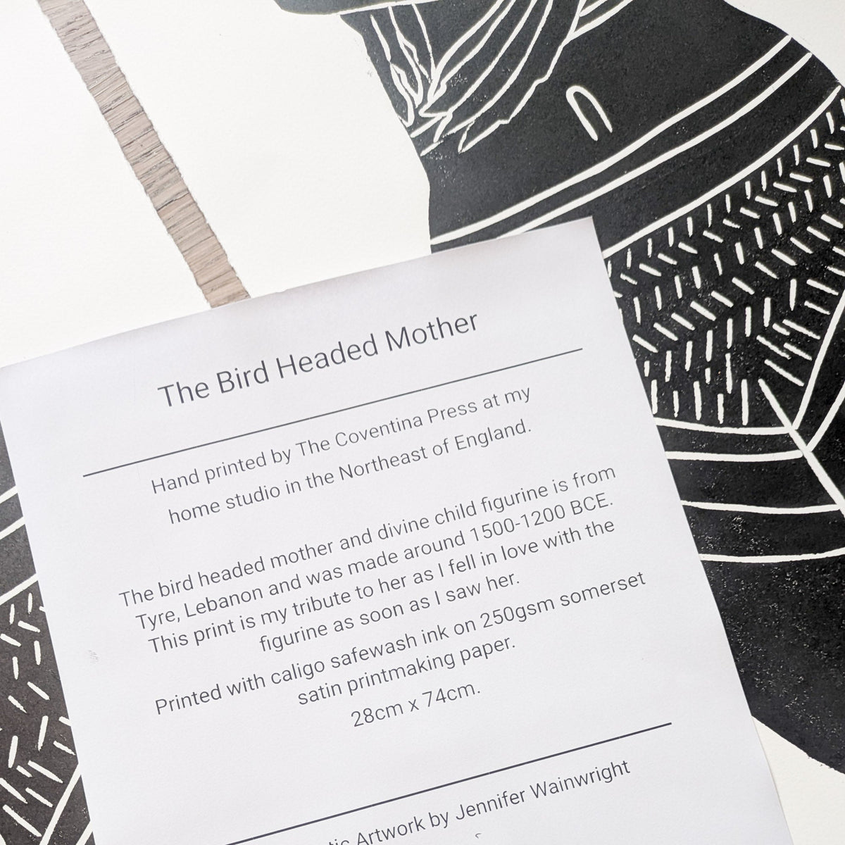 THE BIRD HEADED MOTHER linocut print in black ink on white paper, featuring a stylised bird-headed figure