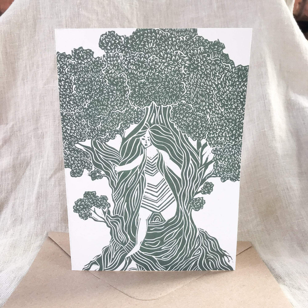 THE DRYAD greeting card with a dark green linocut of a woman entwined in a tree amid dense foliage