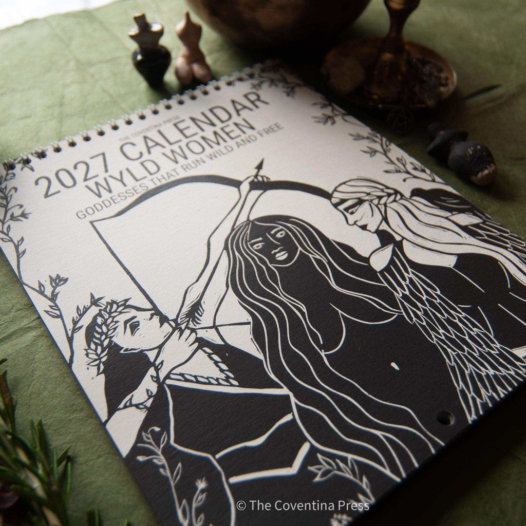 WILD WOMEN CALENDAR featuring a 2027 spiral-bound calendar with black linocut artwork of three goddesses