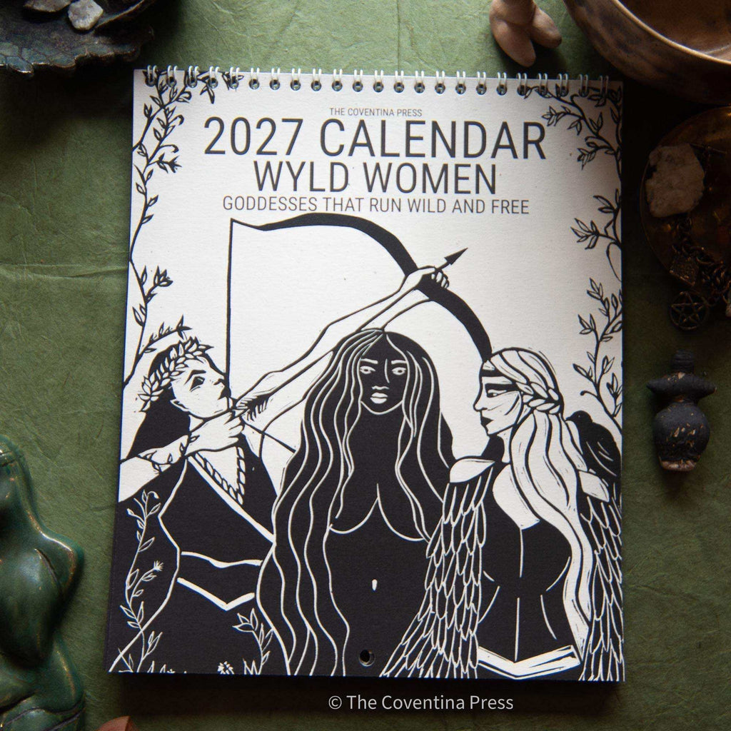 WILD WOMEN CALENDAR 2027 with black and white linocut artwork of three goddesses and a spiral binding