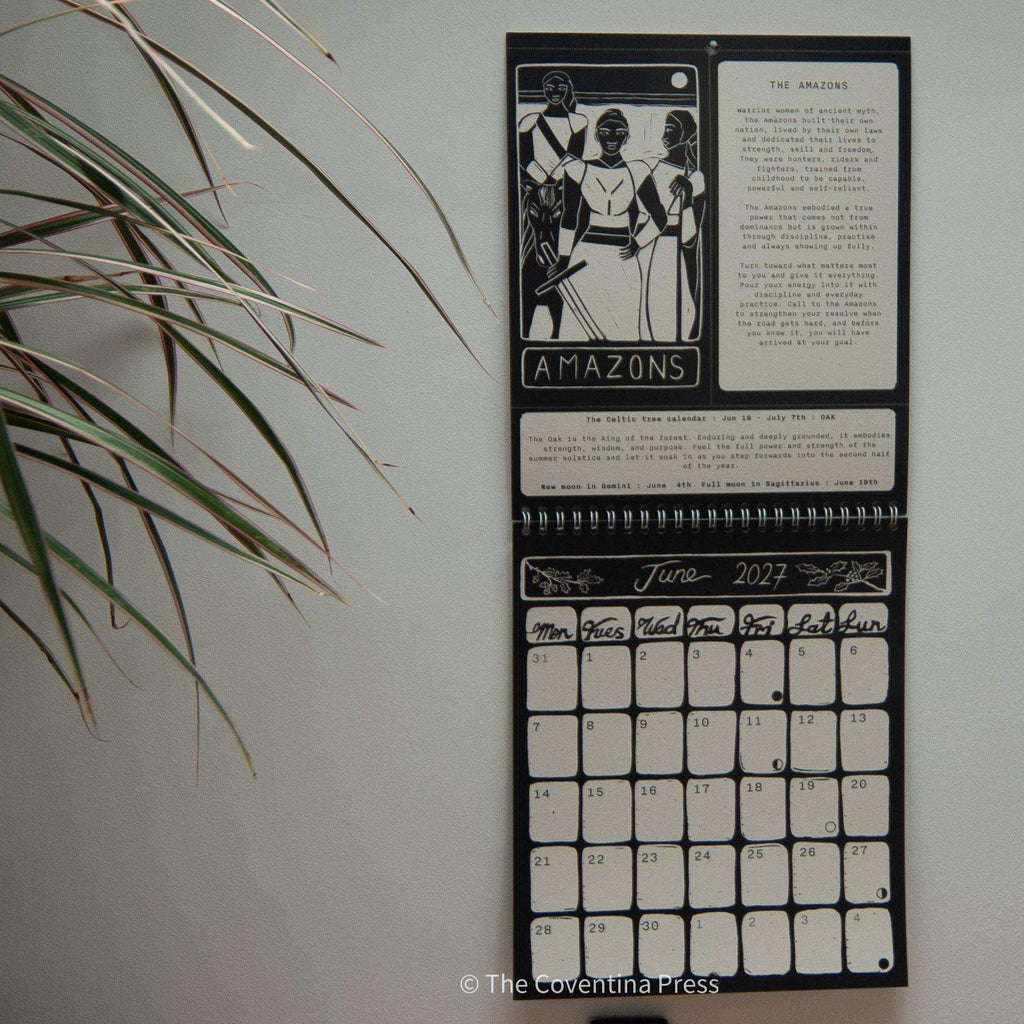 WILD WOMEN CALENDAR wall calendar in black and cream, with spiral binding, linocut Amazons artwork and June 2027 dates