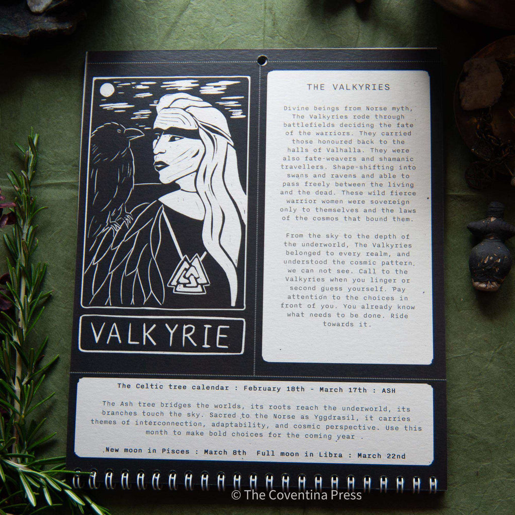 WILD WOMEN CALENDAR showing a black and cream Valkyrie linocut portrait, mythology text and moon phase dates on recycled card